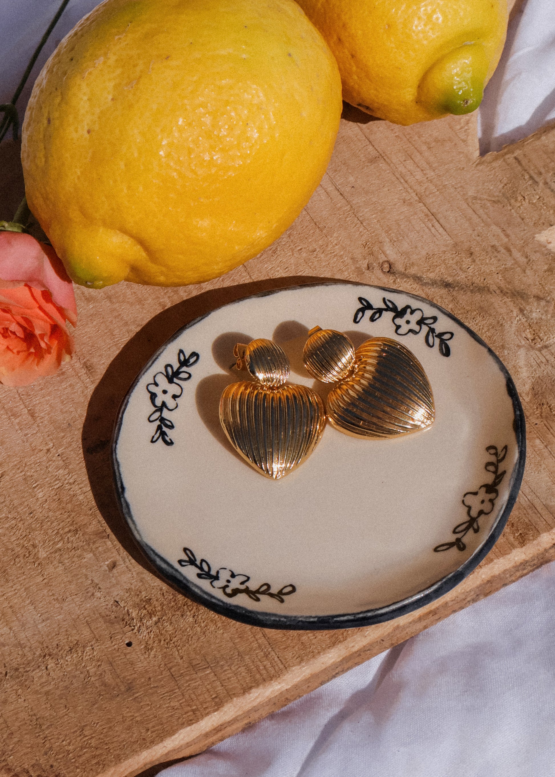 gold heart-shaped earring